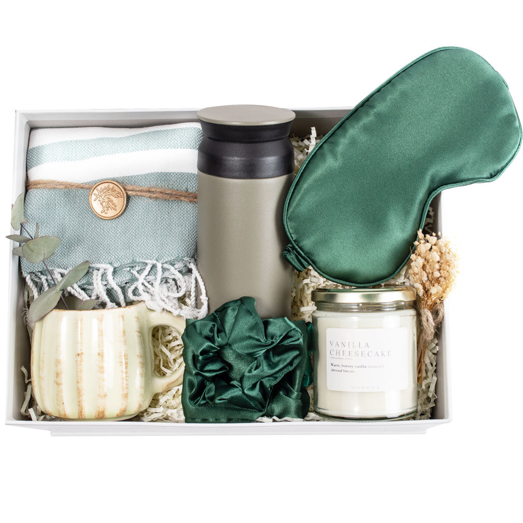 The Evergreen gift box is the perfect place for your recipient to discover the items meant just for them. A thermos, a hand thrown unique one of a kind large mug have created the supreme quality gift box. The hand woven hand towel, luxurious and soft to touch, is set in such a vibrant &amp; beautiful jute fabric Sophistik